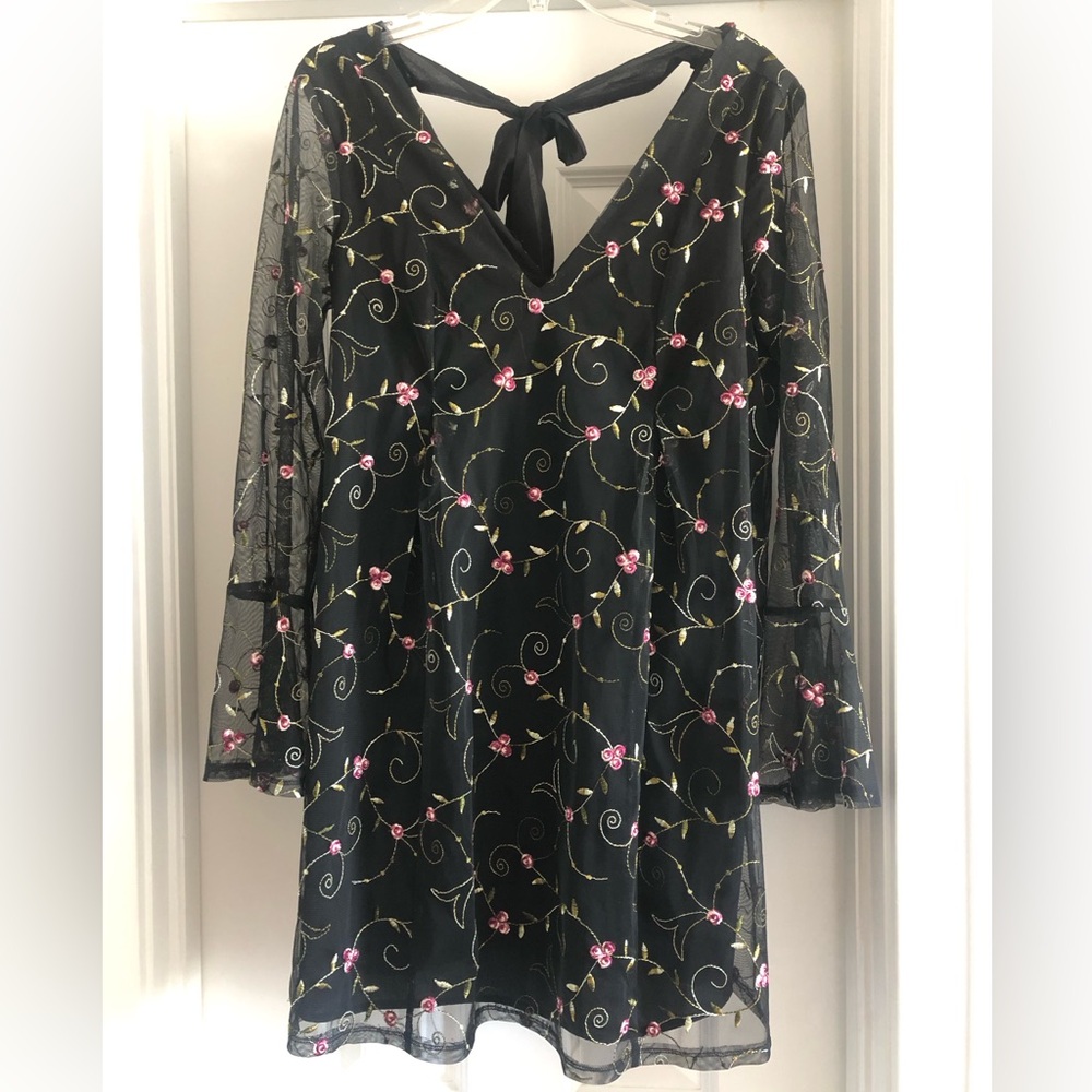 BCBGeneration floral mini dress with sheer long sleeves and tie back